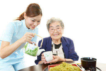 happy elderly woman with her caregiver